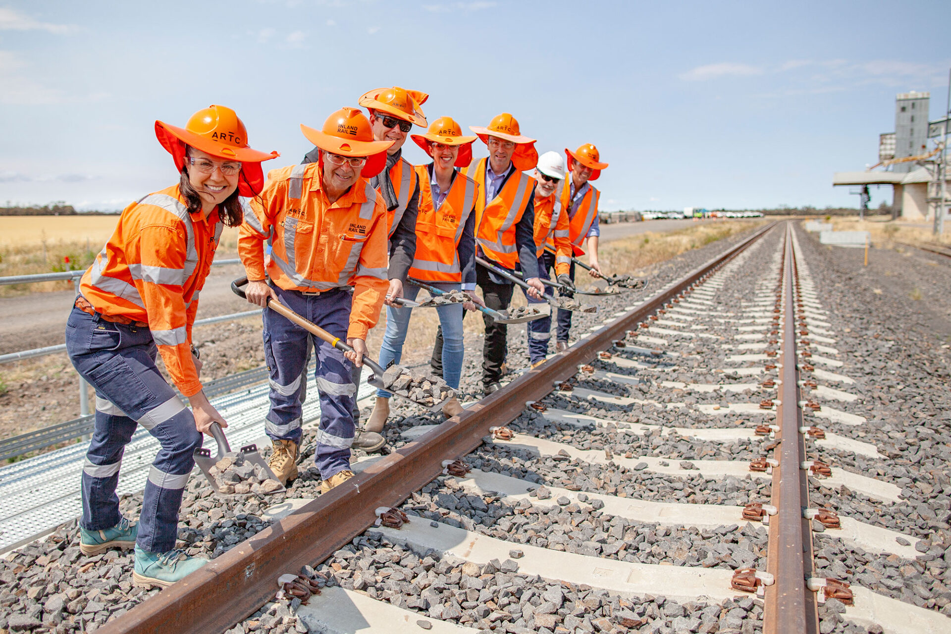 Team members marking the completion of the Narrabri to North Star Phase 1 section of Inland Rail at an opening event at Milguy near Moree, NSW.