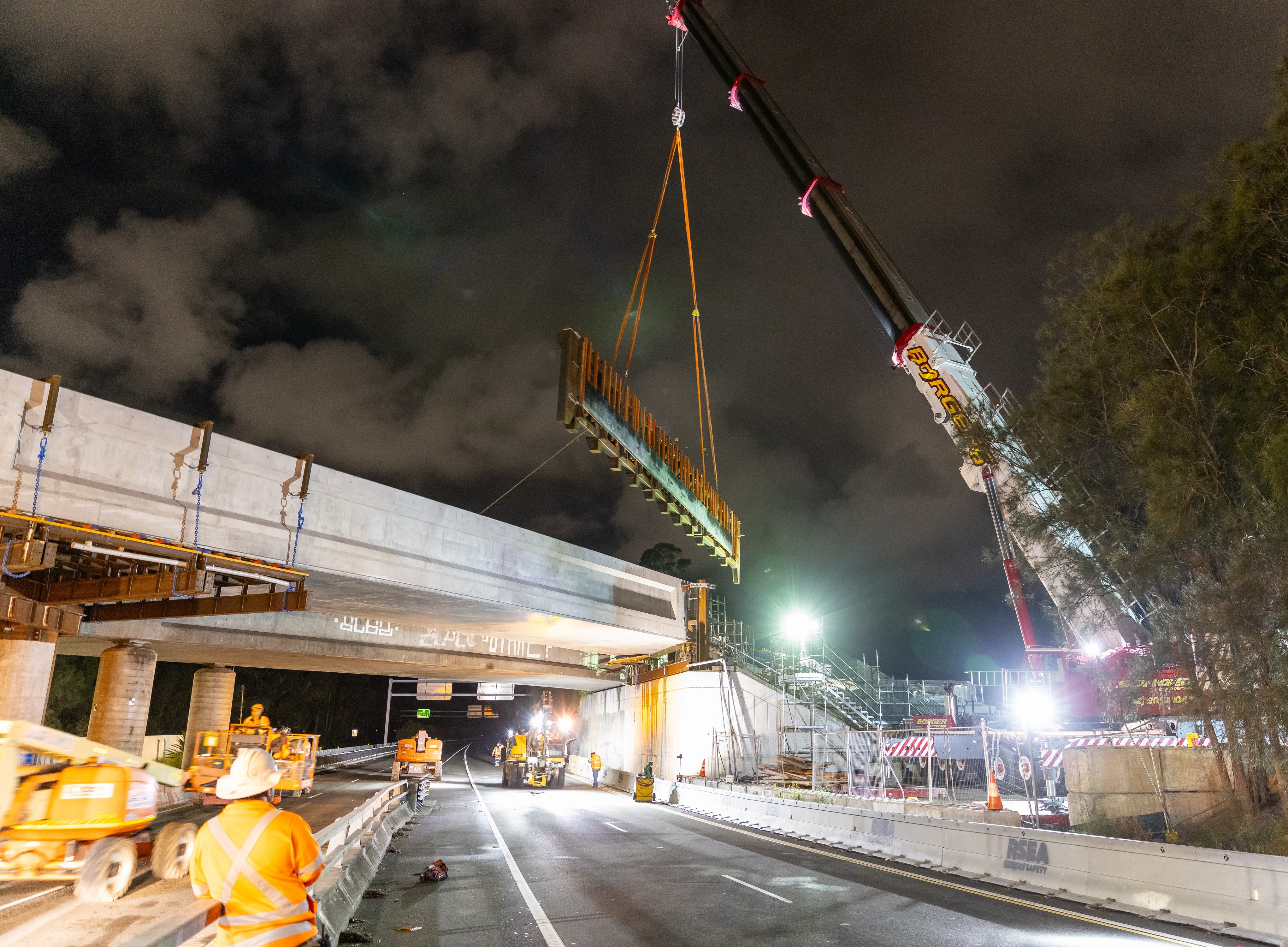 A section of steel truss is removed as part of Botany Rail Duplication works to duplicate the Southern Cross Drive bridge.